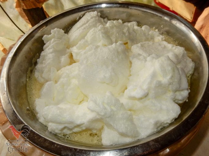 White clouds on a yellow, thick liquid